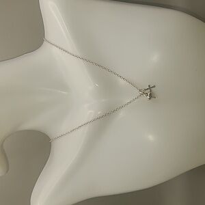 Silver tone necklace with petite heart and cross pendants by Premier Design